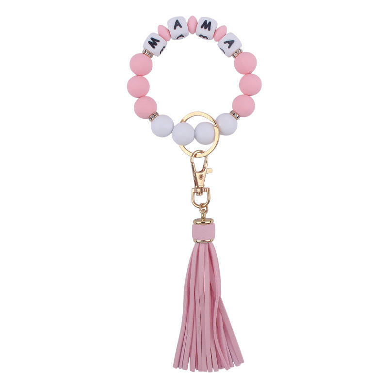 Venta al por mayor Llavero de muñeca con cuentas de estampado de leopardo de silicona